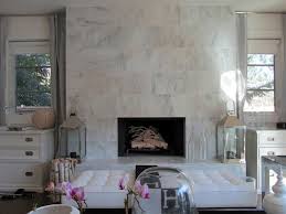 This massive fireplace is clad in random plank sizes of calacatta gold marble. 10 Beautiful Rooms With Marble Fireplaces