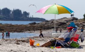 Heat readiates off the sand Sunday at Crescent Beach State Park while...  News Photo