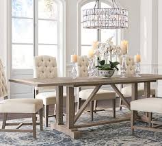 A planked tabletop of dramatic thickness creates a space of warmth for guests and family to gather around. Livingston Extending Dining Table Pottery Barn