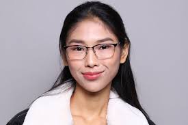 Face of young beautiful Asian woman wearing