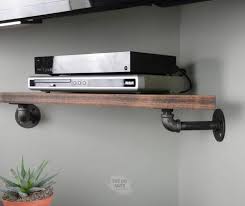 These days anyone can head out to the furniture store and purchase a new tv stand. Build This Clever Diy Corner Shelf For Under Your Mounted Tv Today The Diy Nuts