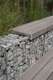 Atmospheric Garden In The Centre Of Naaldwijk On The Water Stone Walls Garden Garden Retaining Wall Gabion Retaining Wall