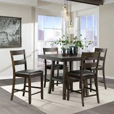 Each piece has a steel frame with two crossbars near the bottom of the table and similar footrests on all sides of the counter stools. Elements Laredo Counter Height Table 4 Stools In 2021 Counter Height Dining Sets Small Space Living Counter Height Kitchen Table