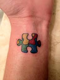 Cool dotwork 3d puzzle piece tattoo on forearm. Autism Tattoos