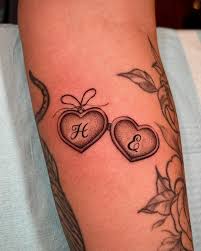 heart lockets are the best way to get an initial tattoo in my opinion! so  cute so demure 💖💕🌸 thank you so much faith! it was a pleasure working