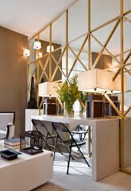 The decorating style of your dining room will also guide you in choosing the mirror, especially with regard to the frame. 7 Stylish Ways To Work With A Mirrored Wall Make It Look Fabulous Mirror Wall Living Room Mirror Dining Room Mirror Wall Bedroom