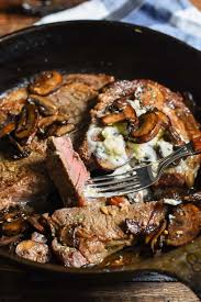 This Cast Iron Ribeye Is Smothered In Garlic Butter Mushrooms It Ll Knock The Socks Off Whoever You Make It F Recipes Campfire Dinner Recipes Grilling Recipes