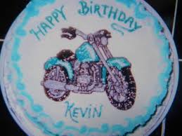 Birthday cake with nuts and vanilla cream decorated with motorcycle figure, red stars and words happy. Motorcycle Birthday Cake Cakecentral Com