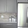 Countertops are of faux marble in browns and beiges. 1