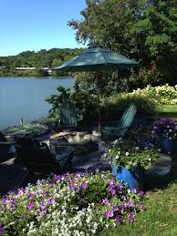 Fire Pit Surrounded By Sky Blue Petunias And Alyssum Garden Design Willow Garden Outdoor Decor