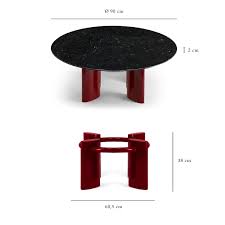 A glass coffee table makes for an elegant, subtle addition to the room, while a coffee table with storage is perfect for creating space for a striking centerpiece. Carlotta Coffee Table Black Marble Top And Red Legs