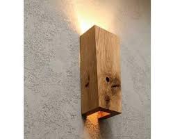 This wall light is a great example of a minimalist outdoor wall sconce. Nastennye Svetilniki Ruchnoj Raboty Dekor Dlya Domaosveshenie Etsy Wall Lights Sconces Wall Lamps Wooden Sconces