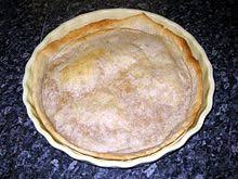If making the pastry by hand, rub the butter into the flour and icing sugar until the mixture resembles breadcrumbs, then stir in the beaten egg and bring together to form a dough. Shortcrust Pastry Wikipedia