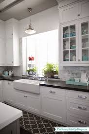 White Cabinets Black Counter Marble Backsplash And An Incredible Garden Window Using Black Countertop As B White Shaker Kitchen Kitchen Design Home Kitchens