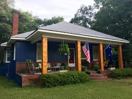 A victorian exterior house featuring a dark blue indigo batik sherwin williams front door; Curb Appeal Dusti B Mccraw