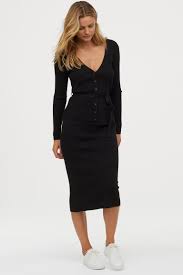 A huge trend on the runways we can't wait to style one with a knit polo and flats. Rib Knit Skirt Black Ladies H M Us Knit Skirt Neutral Fashion Calf Length Skirts
