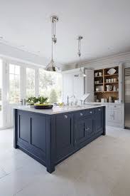 Featuring navy blue cabinets and white subway tile, this navy blue kitchen is an outstanding alternative to classic kitchen design. Decorating With Navy Blue Town Country Living