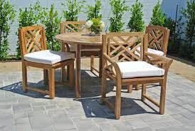 It combines prime solid teak wood, comfortable taupe cushions and welcoming design every outdoor space needs. 5 Pc Monterey Teak Dining Set With 48 Teak Patio Furniture Teak Outdoor Furniture Patio Dining Set