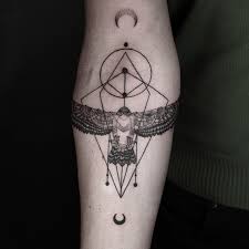 You can go for black or colorful geometric lion tattoos, and you can also get a design that suits your preference. Black Ink Geometric Owl Tattoo On Forearm