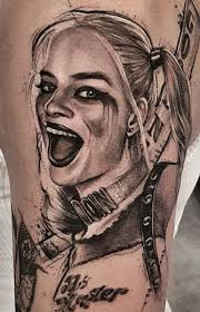 Inks with this nutty lady vary from large realistic portrait style ones to small and simple tattoo images presenting hearts, diamonds or words 'puddin', 'rotten', 'daddy's lil monster. 45 Best Harley Quinn Tattoos Nsf Music Magazine
