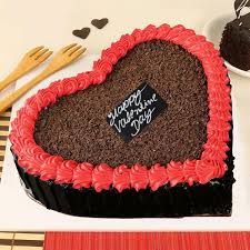 This homemade chocolate cake with vanilla buttercream is decorated with ombre hearts. Valentine Lovie Cake