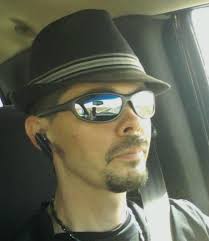 What brand and model of zero-turn mower is recommended for an 8-acre  property with steep slopes?