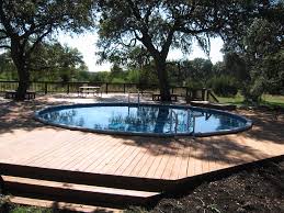20 Luxurious Above Ground Pool Designs In 2020 In Ground Pools Above Ground Pool Decks Backyard Pool Landscaping