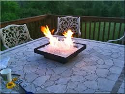 It is made from wood, bricks, fire glass, propane tank cover, wood glue, tape measure, drill, hinges, and barrel bolt lock. Smokeless Portable Propane Fire Pit Perfect For Rv Camping Outdoor Patio Tables Or Custom Fire Pit Tables