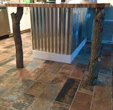 Part Of Our Beautiful Kitchen Raw Oak Tree Posts Corrugated Metal Butcher Block And Amazing Bar Wood T Custom Home Designs Building Design Wood Tile Floors