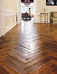 Though all tiles are brown, they have different degrees of darkness. Floors Herringbone Wood Floor Herringbone Floor Flooring