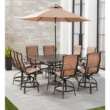 Bistro sets compliment your patio. Hanover Manor 9 Piece Counter Height Outdoor Dining Set With 8 Sling Swivel Chairs 60 In Cast Top Table Umbrella And Stand Mandn9pcsq Br Su