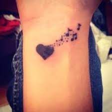 I can't imagine life without music, can you? 13 Music Note Heart Tattoo Ideas Heart Tattoo Music Note Heart Music Tattoos