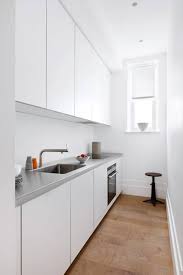The mahogany kitchen island with its white carrara marble worktop came from fullscale woodworking inc, while the drawer unit and white oak shelves and brass brackets were all custom made. Kitchen Worktop Ideas House Garden