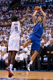 Dirk Nowitzki 41 Of The Dallas Mavericks Shoots Under Pressure From Serge Ibaka 9 Of The Oklahoma Dallas Mavericks Basketball Dallas Mavericks Dirk Nowitzki