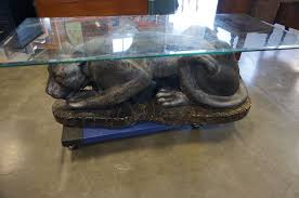 It's definitely a hipster kind of place. Large Ceramic Panther Glass Top Coffee Table