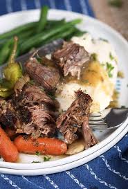 Mississippi Pot Roast On A Fork With A Pile Of Mashed Potatoes And Green Beans Mississippi Pot Roast Pot Roast Recipes Pot Roast