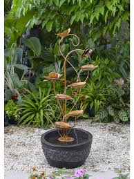 Water fountains add a calming, tranquil element to your home. Scrolling Metal Flowers Fountain Garden Fountains Outdoor Decor Outdoorfountains Garden Fountains Fountains Outdoor Water Fountains Outdoor