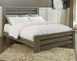 Whether you want a simple set featuring a bed, dresser and mirror or an we have everything from modern king size bedroom sets with panel bed designs for a sleek, contemporary take on your bedroom to sleigh. Ashley Zelen King Panel Bed In Warm Gray Rustic Finish Morris Home Panel Beds