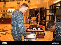 160128-N-UZ637-001: ATAN Clayton Linebarger grabs some breakfast in the  barracks before heading to work at Fleet Readiness Center Southeast. CS2  Patrick Sampson keeps the barracks Grab-N-Go well stocked. Photo by Barbara  Burch,