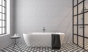 Black and white bathroom design with a white washstand against a black wall warmed with a gold thin frame mirror and a polished brass vintage cross handle faucet. 30 Black And White Bathroom Design Ideas Design Cafe