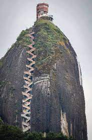 Peñón de guatapé is an outcrop of the antioquia batholith and towers up to 200 meters (656 feet) above its base. 659 Steps To The Top The Guatape Rock In Colombia Would You Climb This Rock Beautiful Places Places Places To Go
