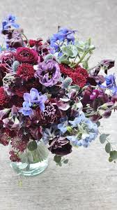 Evergreen leaves are dark green and glossy. Burgundy Plum Navy Bridal Bouquet Mt Hood Oregon Resort Wedding Flowers Bridal Bouquets Oregon Wedding Portland Oregon Wedding