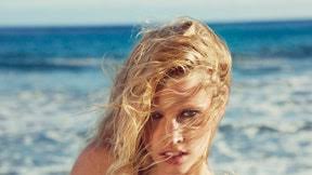 Some models are having brackets inserted between their front teeth. Lara Stone Hits The Beach Gq