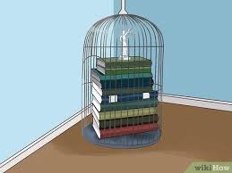 Birdcages serve as graceful table centrepieces. 3 Simple Ways To Decorate A Bird Cage Wikihow