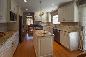 Cream kitchen cabinets offer a warm feel and elegant look in any cooking area. Slate Appliance Houzz