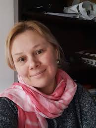 Beth McGunshire, the owner of The Wooden Trinket, a magical item store  based around wood and natural materials. She is a Dinarint Witch who still  runs her store in the city. |