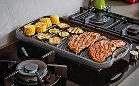 A range can be installed in between cabinets or can be freestanding. Amazon Com Uno Casa Cast Iron Griddle Grill Pan For Stove Top 20x10 Inch Pre Seasoned Camping Griddle With Chainmail Cleaner Kitchen Dining