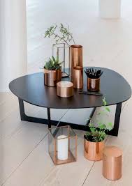 In our second inspirational home interior, soft copper dining room decor stretches out behind a grey modern sofa. 17 Inspirational Ideas To Decorate Your Home With Copper Elements
