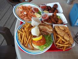 Try out some of the recipes or use it to decorate an empty coffee table. 2 Kinds Shrimp Mahi Mahi Conch Fritters More Picture Of Key Largo Fisheries Backyard Cafe Key Largo Tripadvisor