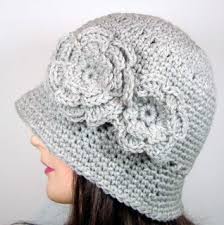 Get the free pattern and video tutorial here. Cloche Hat With Two Flowers Crochet Pattern By Melissa Martinez